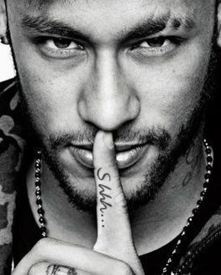 Soccer superstar Neymar showing he has taken the vow of silence and also with the Shhh tattoo on his finger