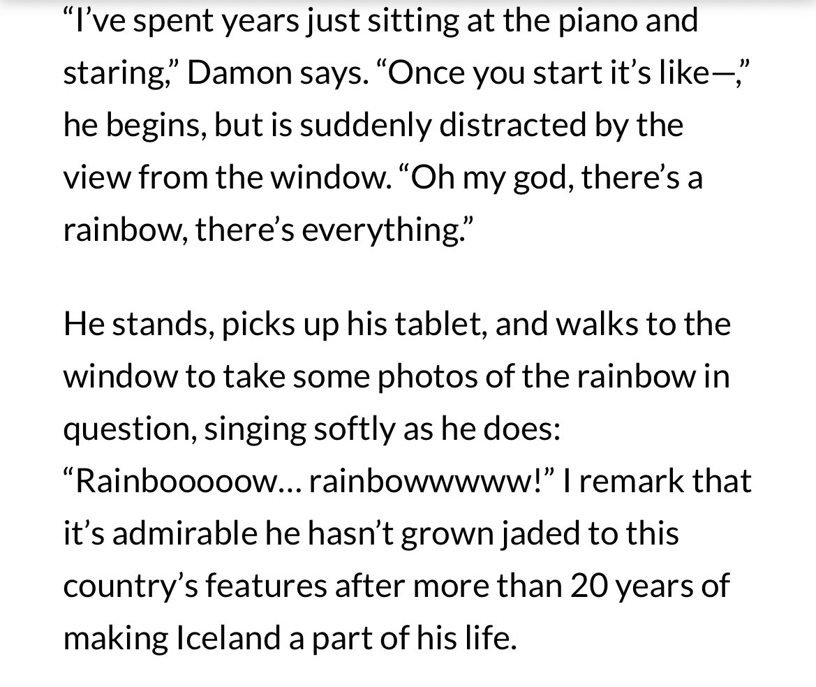 damon albarn taking a picture of a rainbow with his ipad mid interview