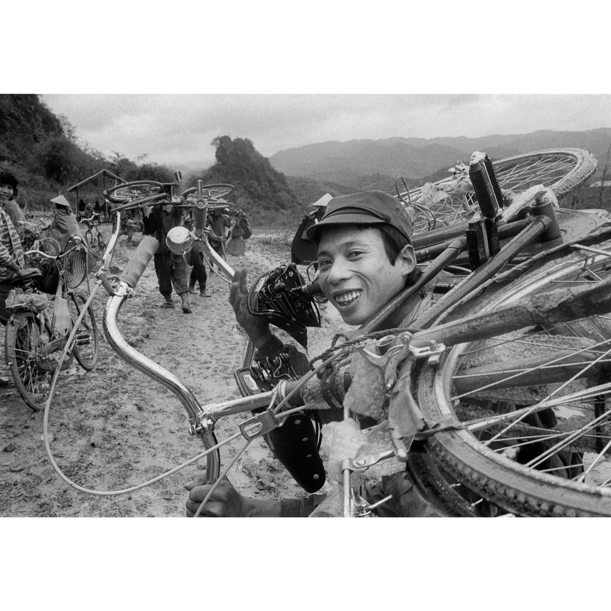 Thinking about a series of small thematic books: a second one could be "Smile you're on camera".
VIETNAM. Dong Dang. 15/03/1990. Porters importing Chinese bicycles and goods at the border with China.