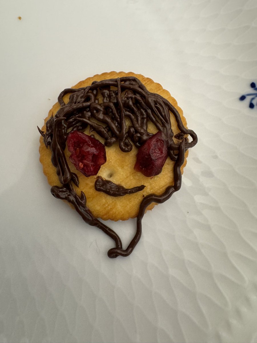 knmc ty drawn by me on a ritz cracker with those chocolate pen thingies (his eyes on the second image are cranberries)