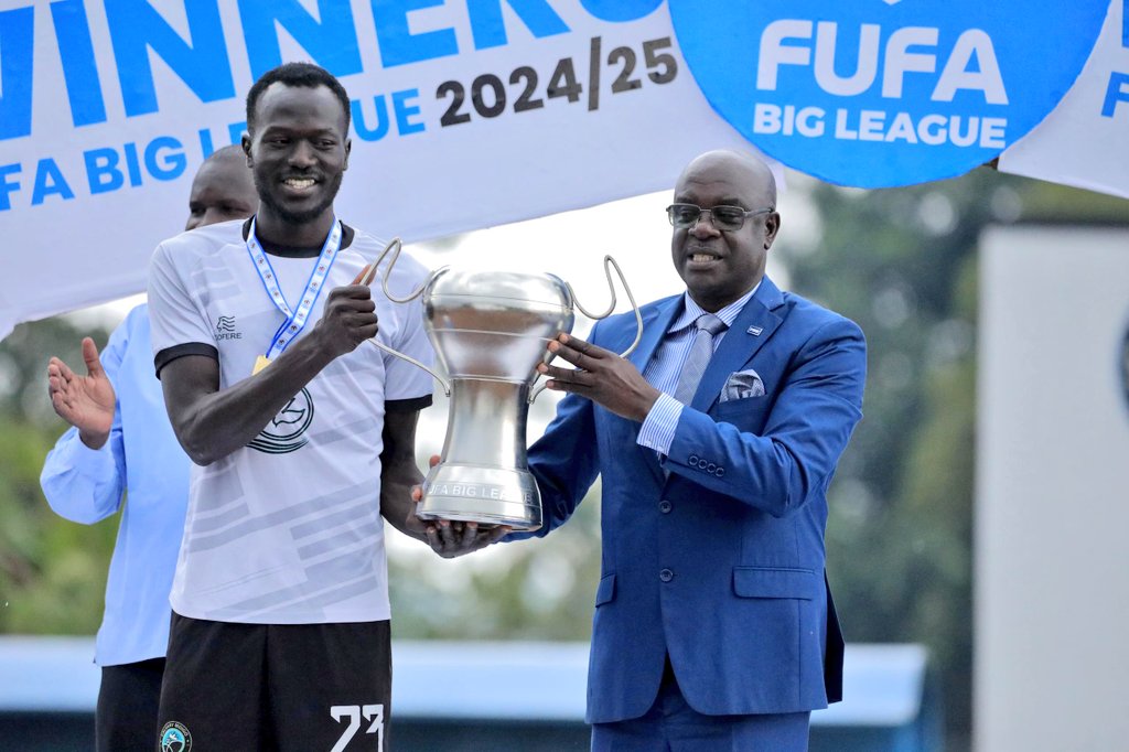 FUFA Big League (@fufabigleague) on Twitter photo FUFA Executive Committee Member Rogers Mulindwa handing over the new #FUFABigLeague trophy to Calvary FC (<a href="/calvaryfcm/">Calvary FC Midigo</a>) captain Ronald Owiny today. FUFA Executive Committee Member Rogers Mulindwa handing over the new #FUFABigLeague trophy to Calvary FC (<a href="/calvaryfcm/">Calvary FC Midigo</a>) captain Ronald Owiny today.