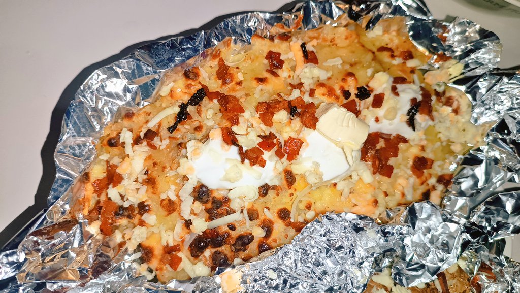 Dinner for today

Braised and baked St. Louis Cut Ribs (cooked with hickory and honey mustard braise)

Potatoes two ways, loaded mashed potatoes and baked marble potatoes