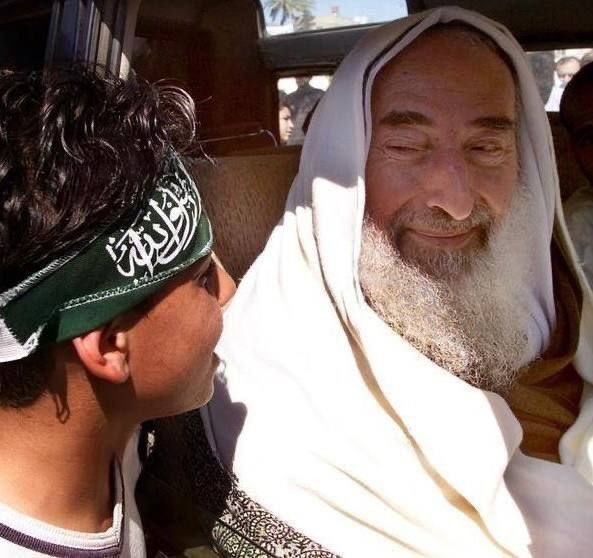 Martyr Sheikh Ahmed Yassin and Palestinian boy.