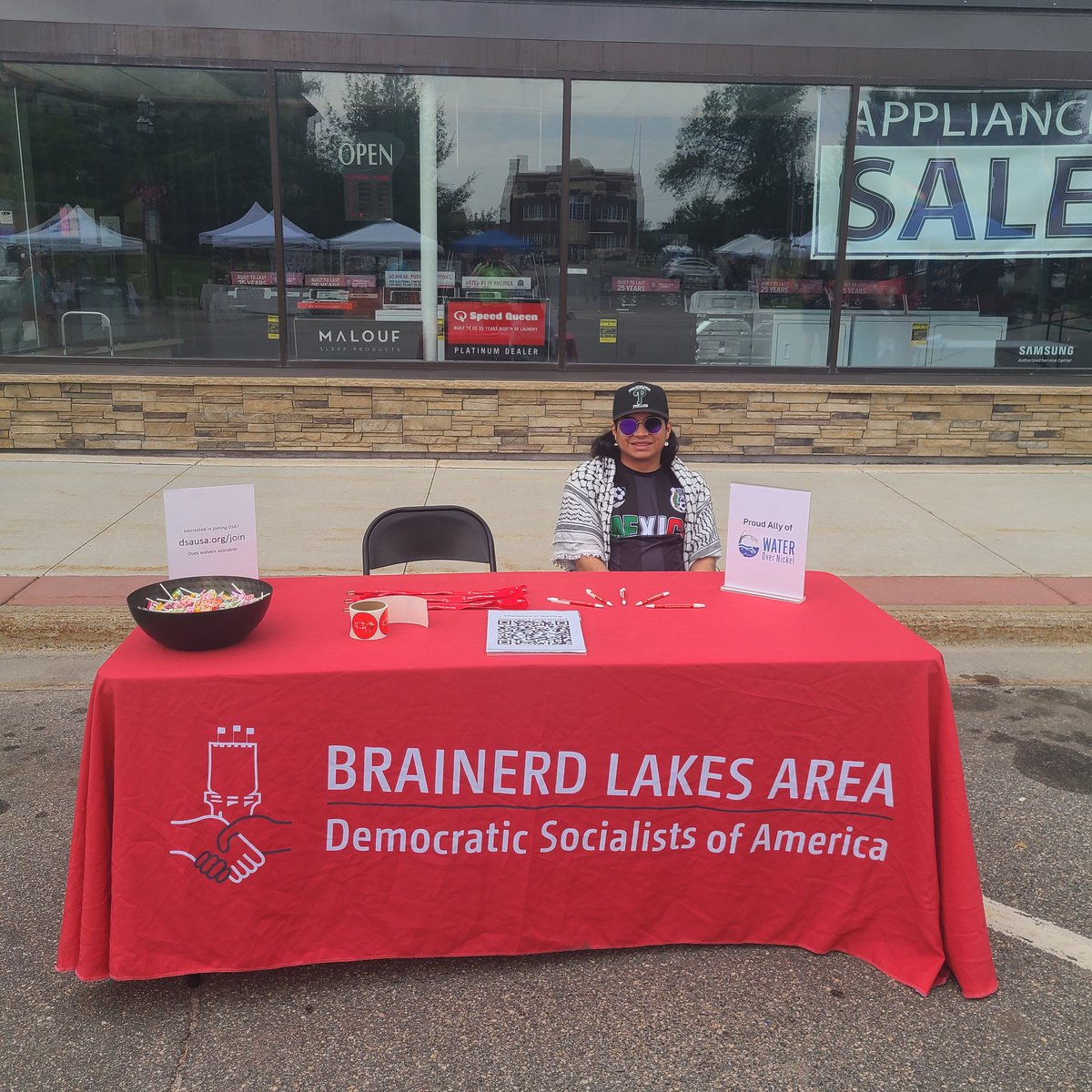 We're here at Itasca Pride talking with folks. If you're in the area, feel free to stop by, grab some candy, and chat with us about the future of democratic socialism in Central MN and beyond!