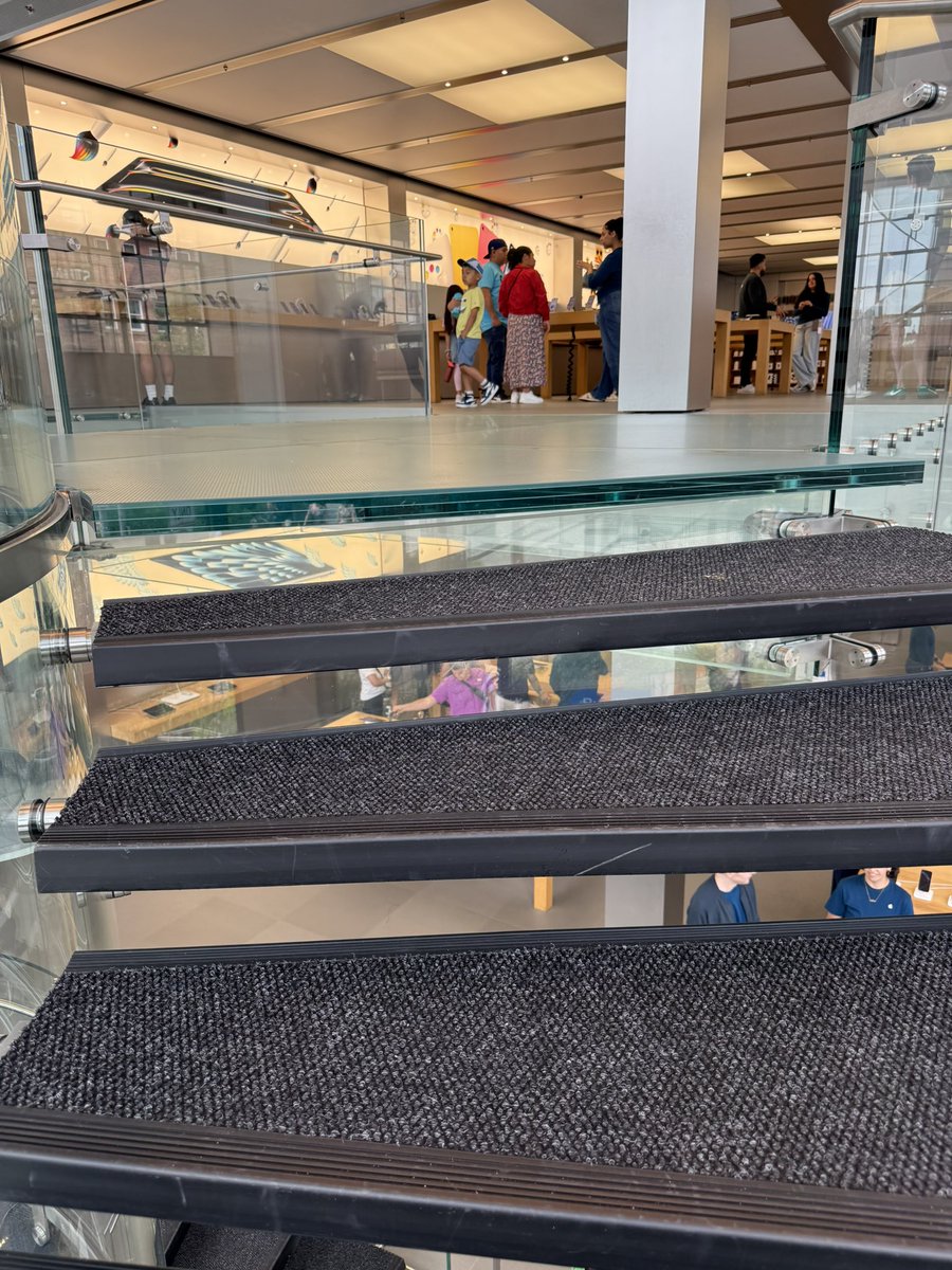 thejamescad's tweet image. Apple Store NYC covering up the beautiful stairs to prevent people from slipping is v decel