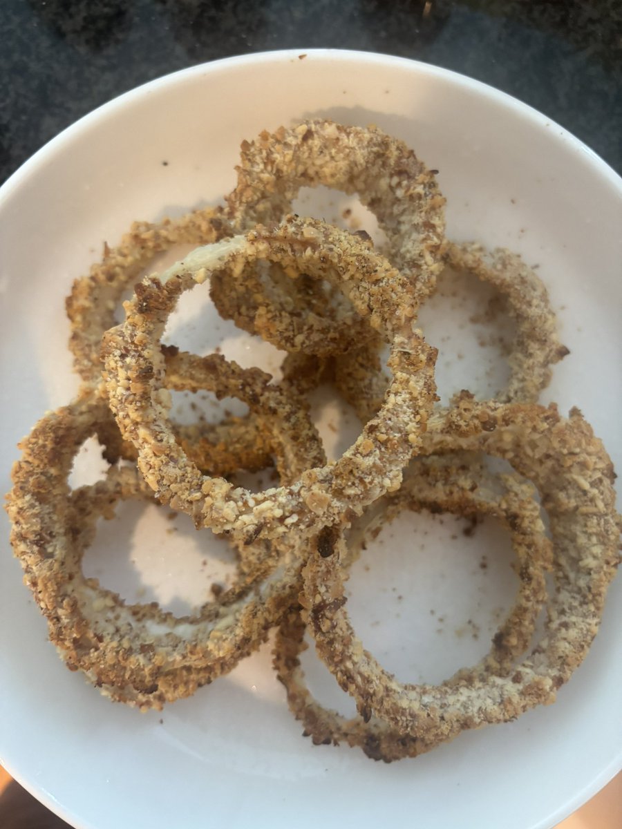 Almond crusted onion rings. I try to eat the same foods I’ve always loved while continuing to cut back on animal products. I made these w/ a simple vegan batter of flour &amp; soy milk. I add cumin, coriander, &amp; clove to the usual seasonings to give them a unique &amp; smoky flavor.