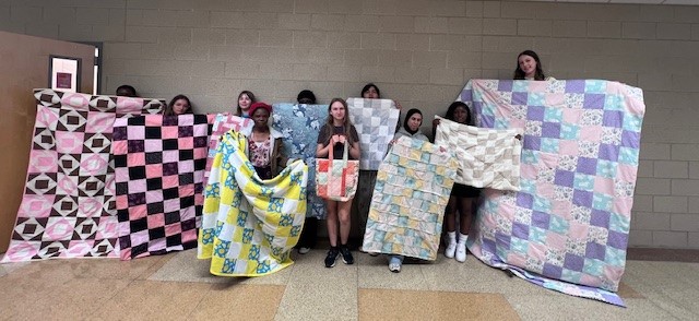 The students in Elizabeth Scott’s Sewing and Textile Arts class, at Davies High School, spent the past 6 weeks of the school year making quilted projects. They began learning with a nine-patch pillow and then moved on to their own designed, final projects.