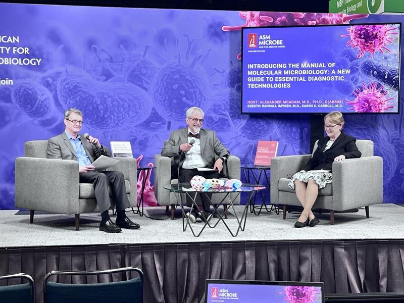 ASMicrobiology's tweet image. Randall Hayden, Karen Carroll &amp;amp; Alex McAdams, editors of the new Manual of Molecular Microbiology, took to the #ASMicrobe studio stage to spotlight key updates in molecular techniques &amp;amp; translational insights shaping the field today—then posed for a fun pic at the ASM booth!