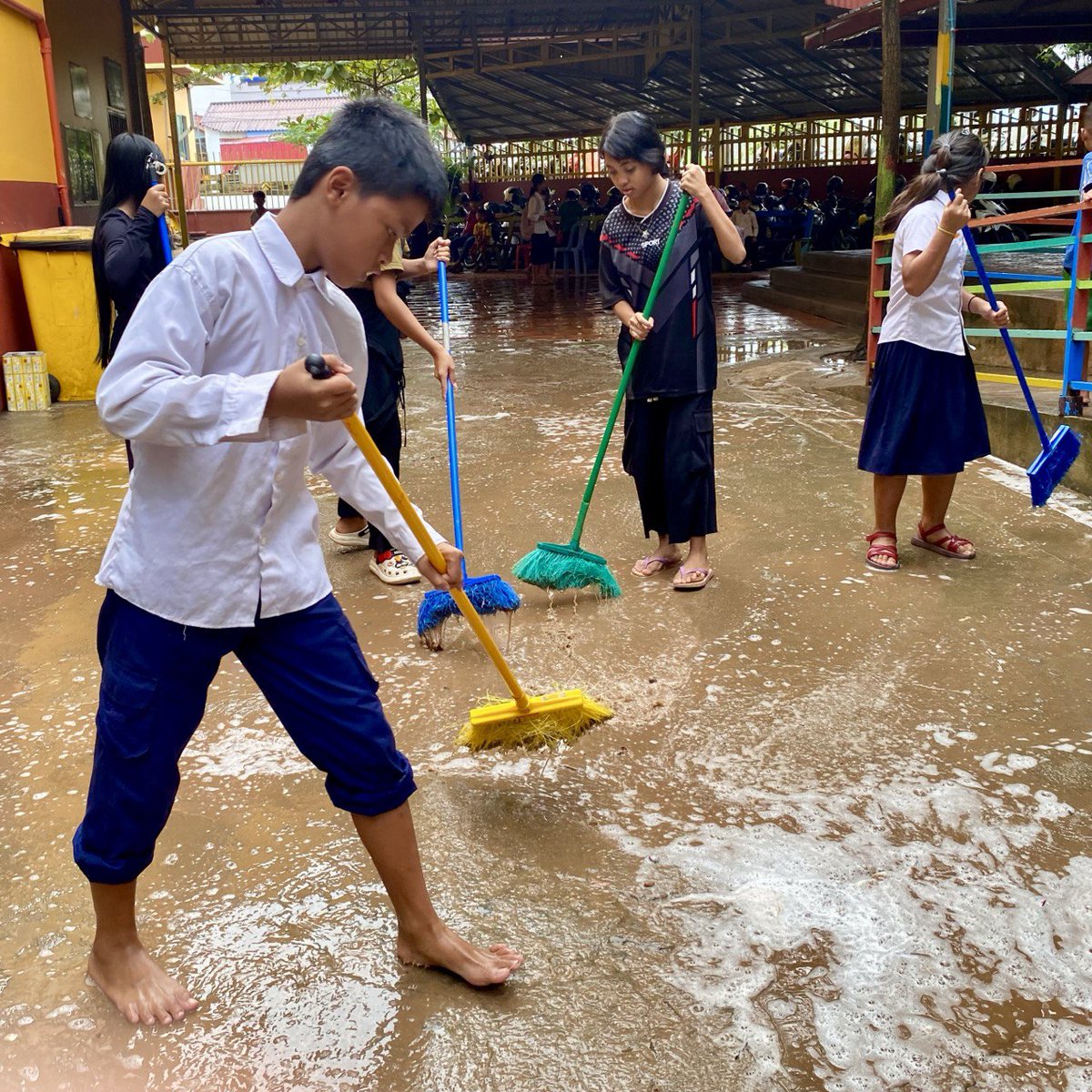 After a very, very rainy weekend here in Sihanoukville, there is a lot of clean-up to do, and everyone is pitching in to help.