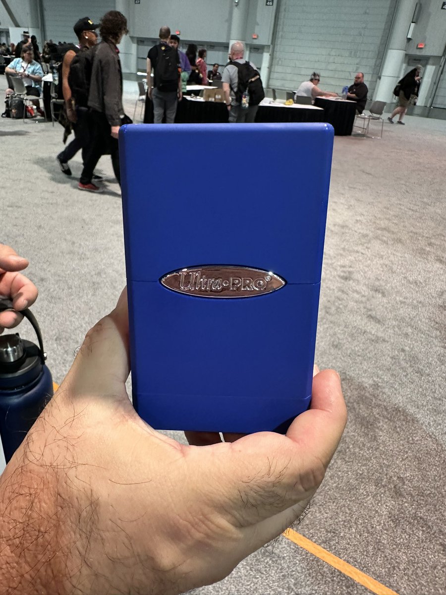 This is a deck box that I found at the white table in creator central. It has been taken by staff to lost and found. It has a deck inside. I hope you get your deck back, whoever you are!