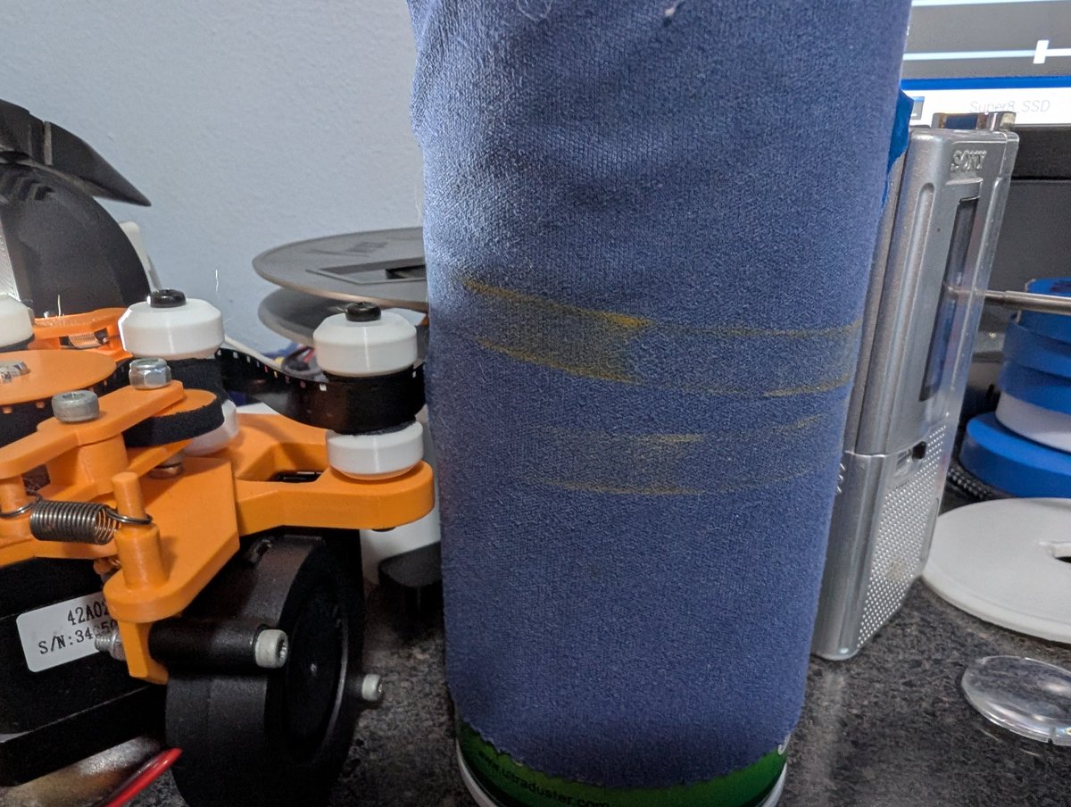 Using this can as a large reel tensioner that I didn't design. Man, look at all that dust! Maybe I should add a wiper here too.