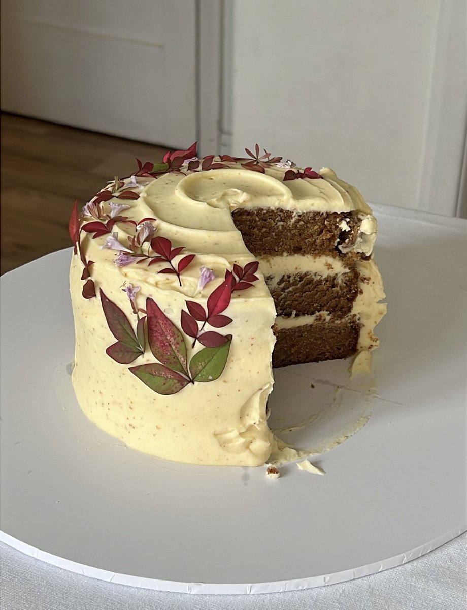 a rustic lil carrot cake with brown butter cream cheese frosting decorated with foliage from my garden