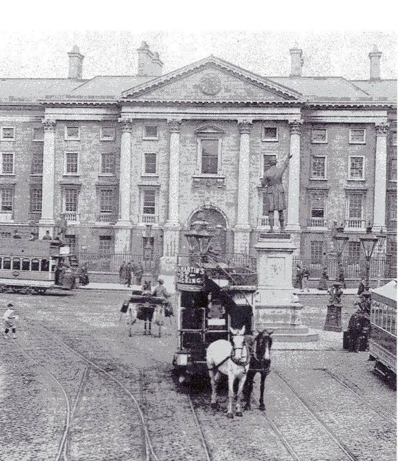 Horse drawn taxi outside Trinity College in Dublin. c. 1900