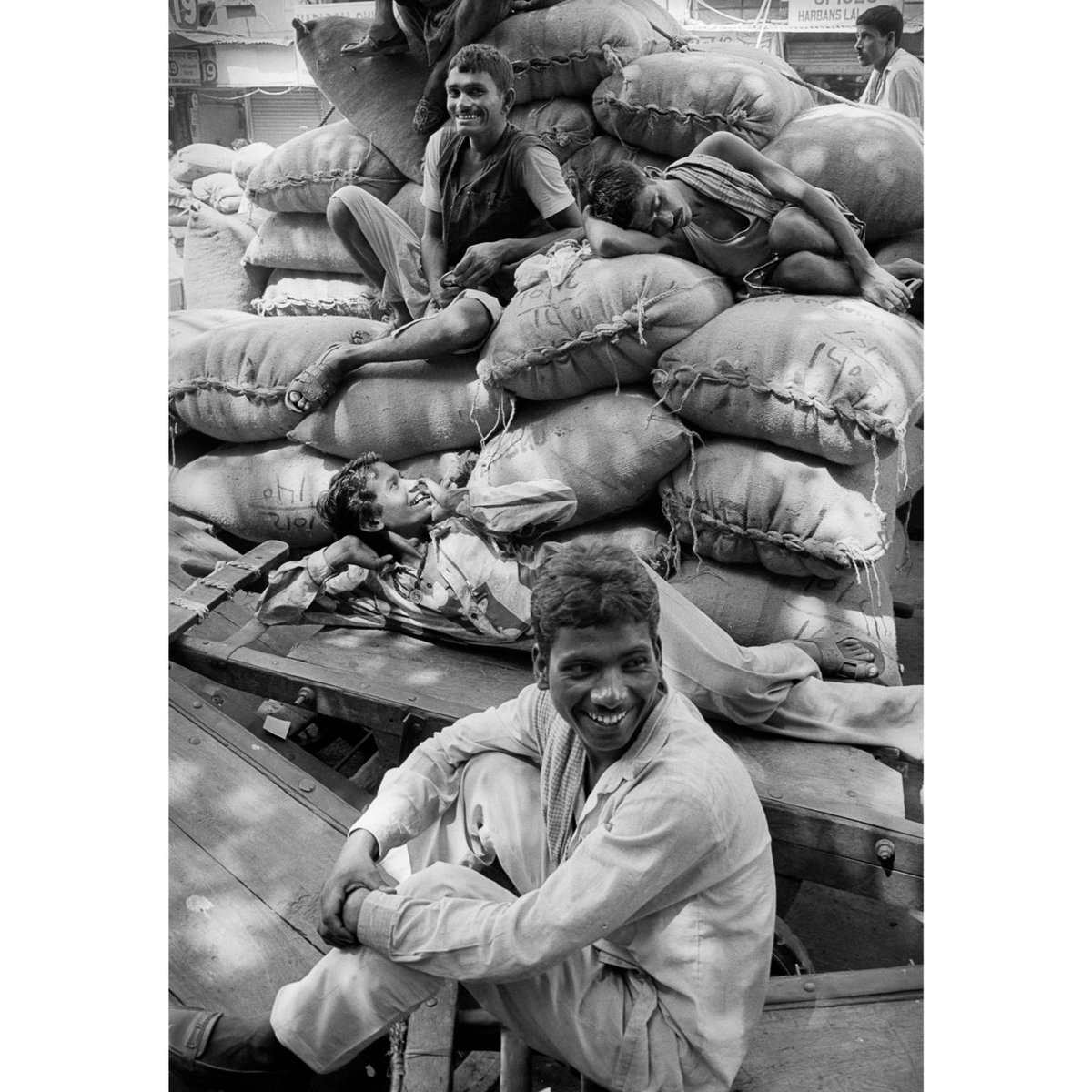 Thinking about a series of small thematic books: a second one could be "Smile you're on camera".
INDIA. Delhi. 24/09/1996: Resting porters at Lahoori Gate.