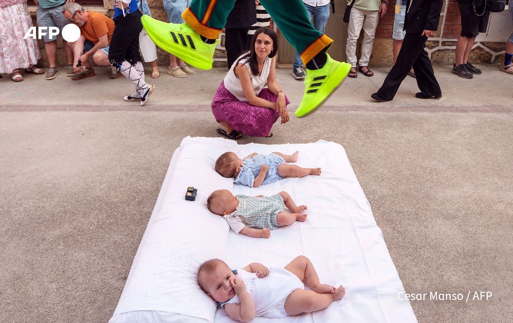 AFP’s Cesar Manos photographs "Colacho", a character representing the devil, jumping over babies during 'El Salto del Colacho' (The Devil's Jump) festival, in the village of Castrillo de Murcia, Spain.

“El Colacho” is a traditional Spanish ritual dating back to 1620, in which