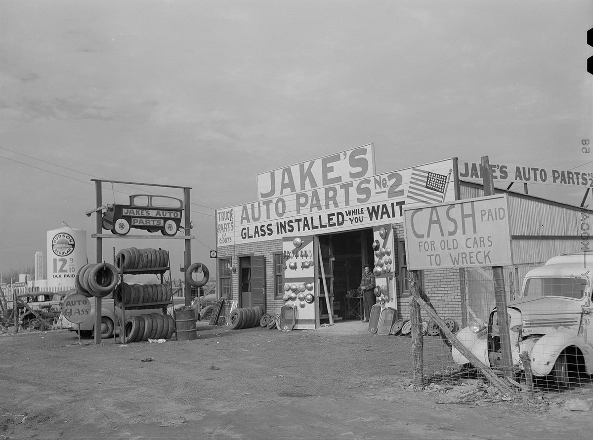 Jake's Auto Parts between Fort Worth and Dallas in 1942. It makes me wonder where Jakes Auto Parts #1 was located. Those tires were a prized commodity in 1942.
This sensational photo with its wonderful details was taken by Arthur Rothstein.