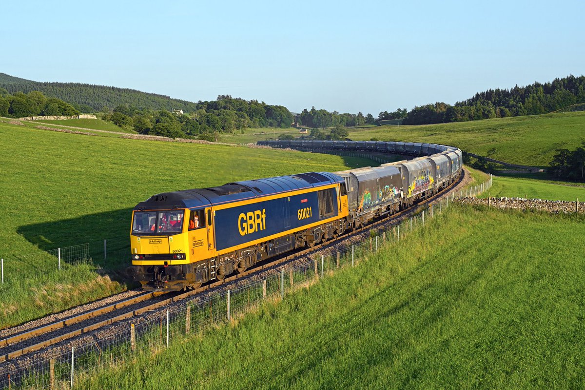 With a gleeful looking driver enjoying his evening work, 60021 'Pen-y-ghent' tackles the incline at Hetton Beck (near Rylstone) on a crystal clear 18th June 2025 with the 6D67 17:54 Hunslet Tilcon to Rylstone (Swinden Quarry) empty HYA hoppers.