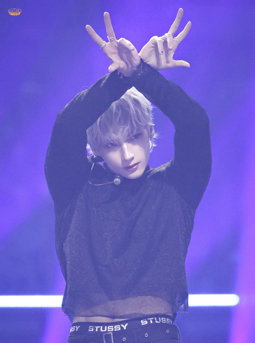 HUENINGKAI raises up his signature K is for Kai Kamal Huening pose.