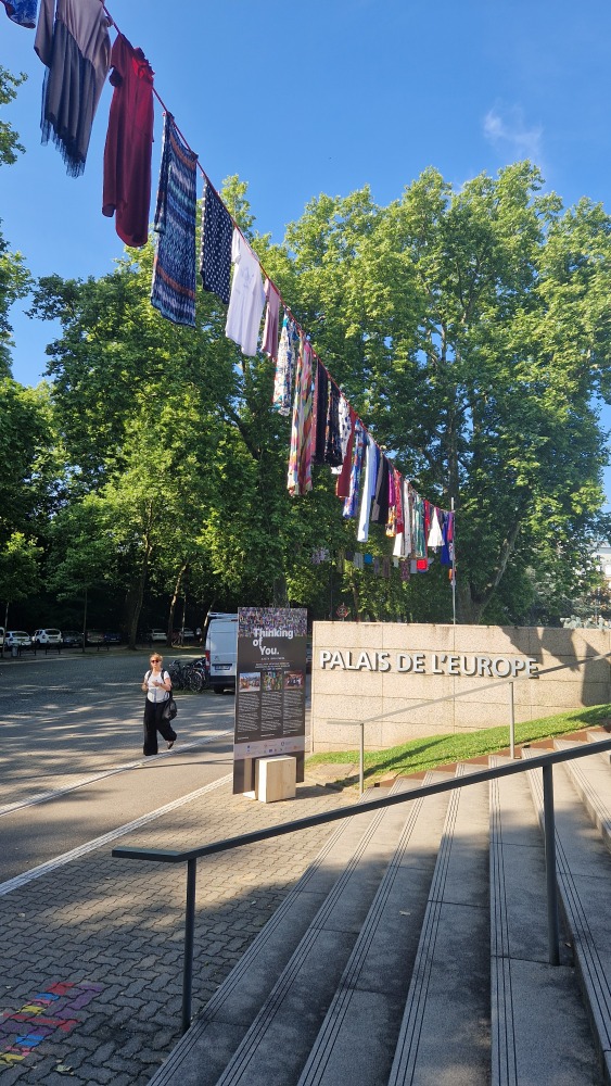 SM_Strasbourg's tweet photo. 🇨🇿 mission happy to be one of the supporters of the ´Thinking Of You´ art installation in front of the Palais de l'Europe. Dresses donated by survivors of sexual violence from over 20 countries around the world are testimonies to the human consequences of sexual violence. https://t.co/T8cf0EoqL1