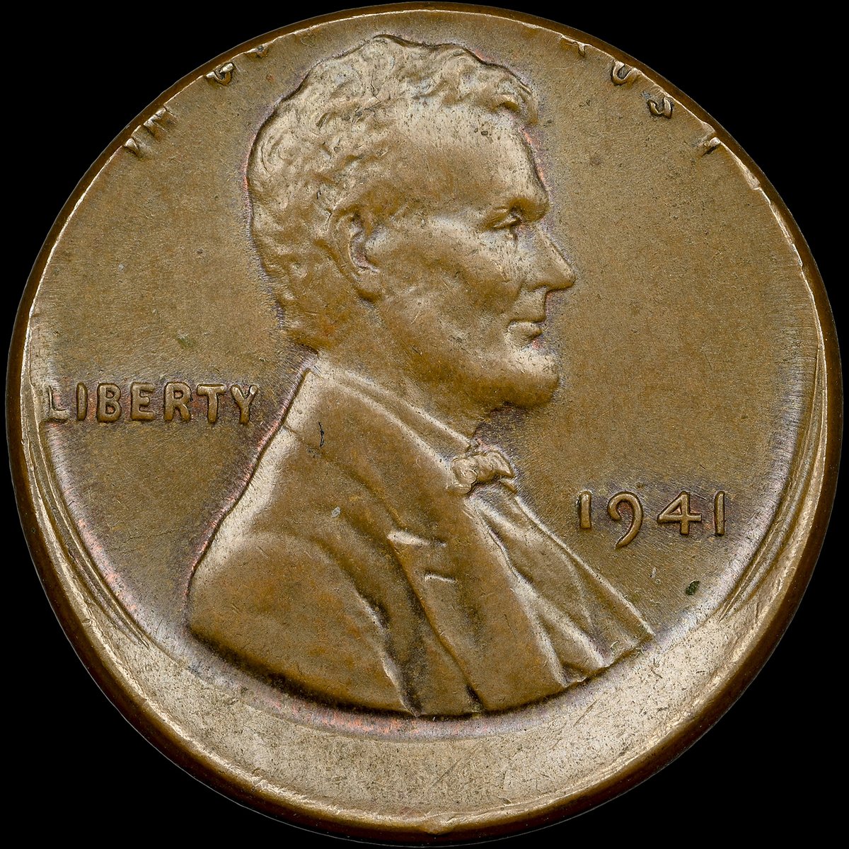 NGCcoin's tweet image. Coin of the Day: For #MintErrorMonday, here’s a 1941 Lincoln Cent that was struck 10% Off Center. It’s part of a @HeritageAuction sale of error coins today: tinyurl.com/32nysfmn #errorcoins #numismatics #coincollecting #lincolncent #penny #offcenter #minterror #uscoins