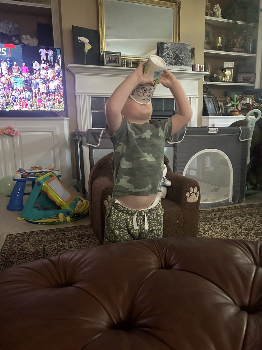 Teaching my grandson to drink coffee! I think he likes it!