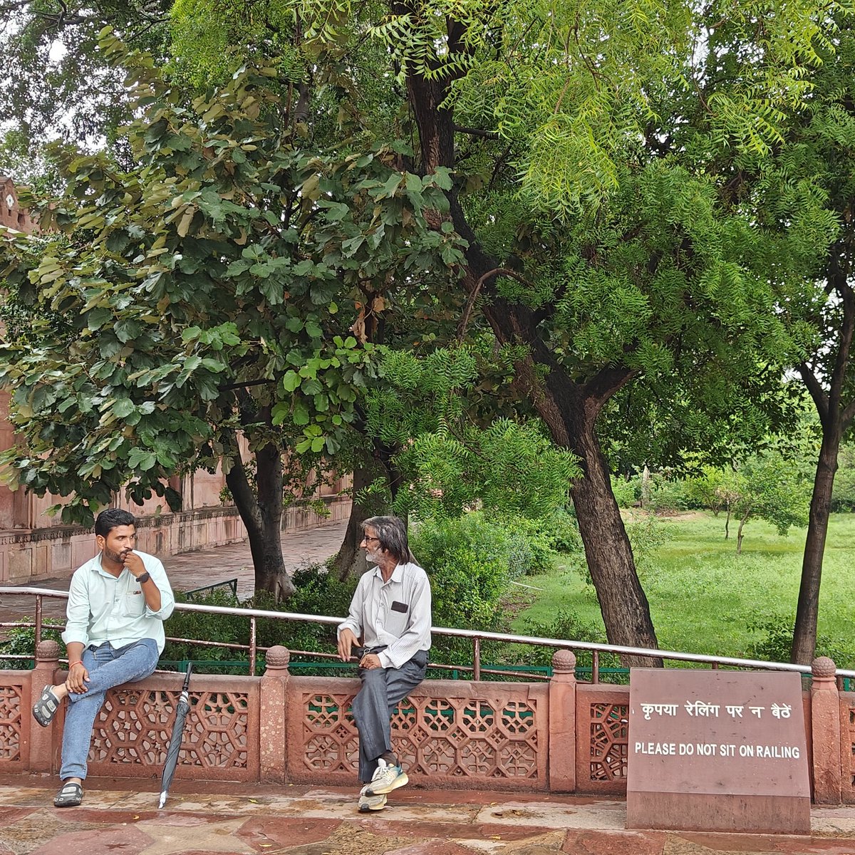 When it says, don't sit on the railing, of course you do.