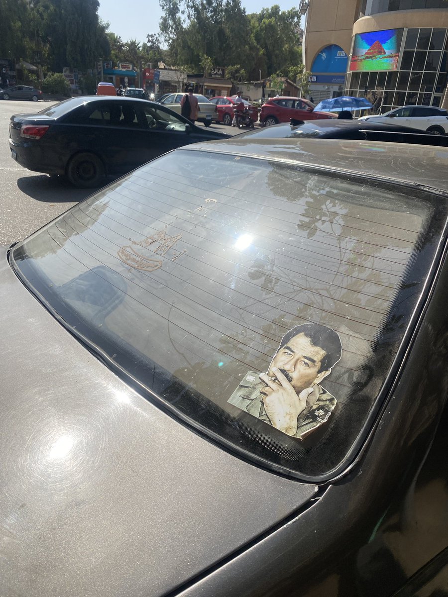 ستيكرات صدام حسين علي العربيات و المكيروبصات في القاهرة ظاهرة تستحق الدراسة