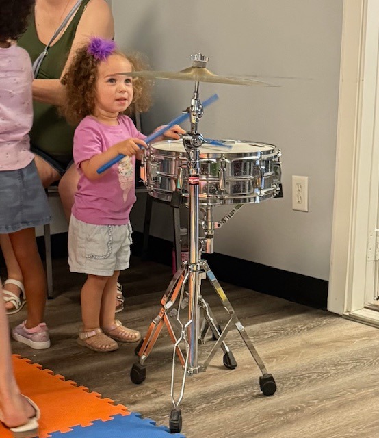 Music faculty have been visiting Brazoria County Libraries this summer to introduce children to different musical instruments.