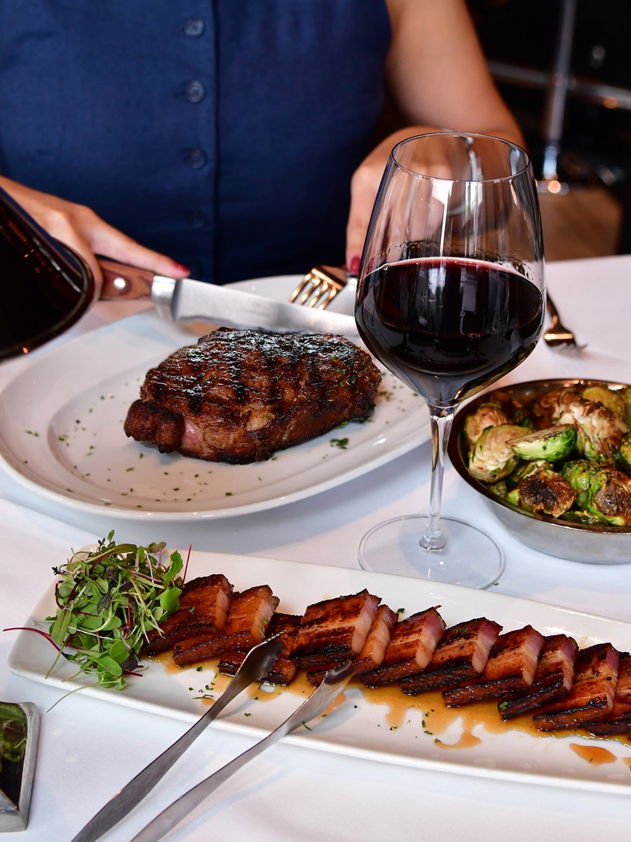 Nueske’s Maple Glazed Bacon, a sizzling Ribeye, and a perfect pour of wine — this is how Mastro’s does indulgence.