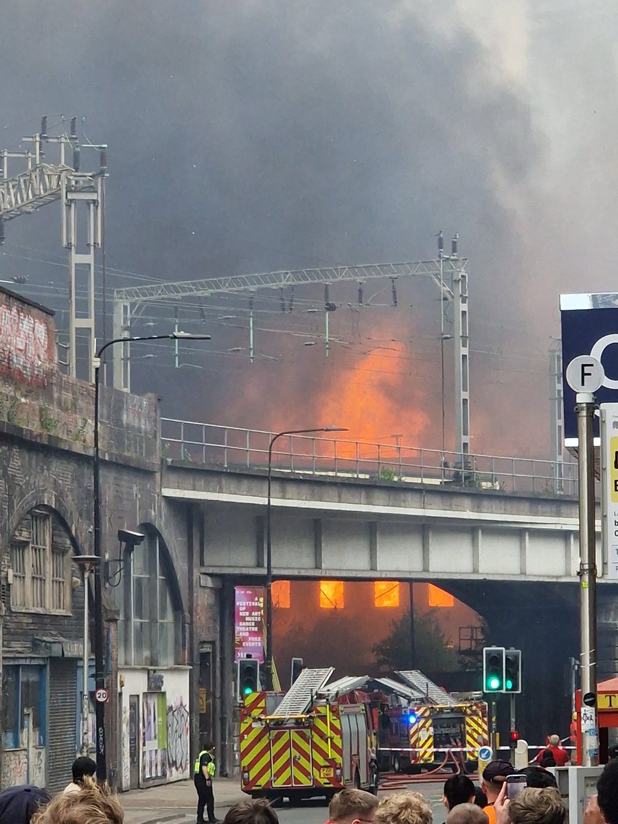 oschmidthansen's tweet photo. Part of roof collapsed and smoke and ash blowing eastwards towards picadilly/ardwick https://t.co/7aH3t6Nv4u