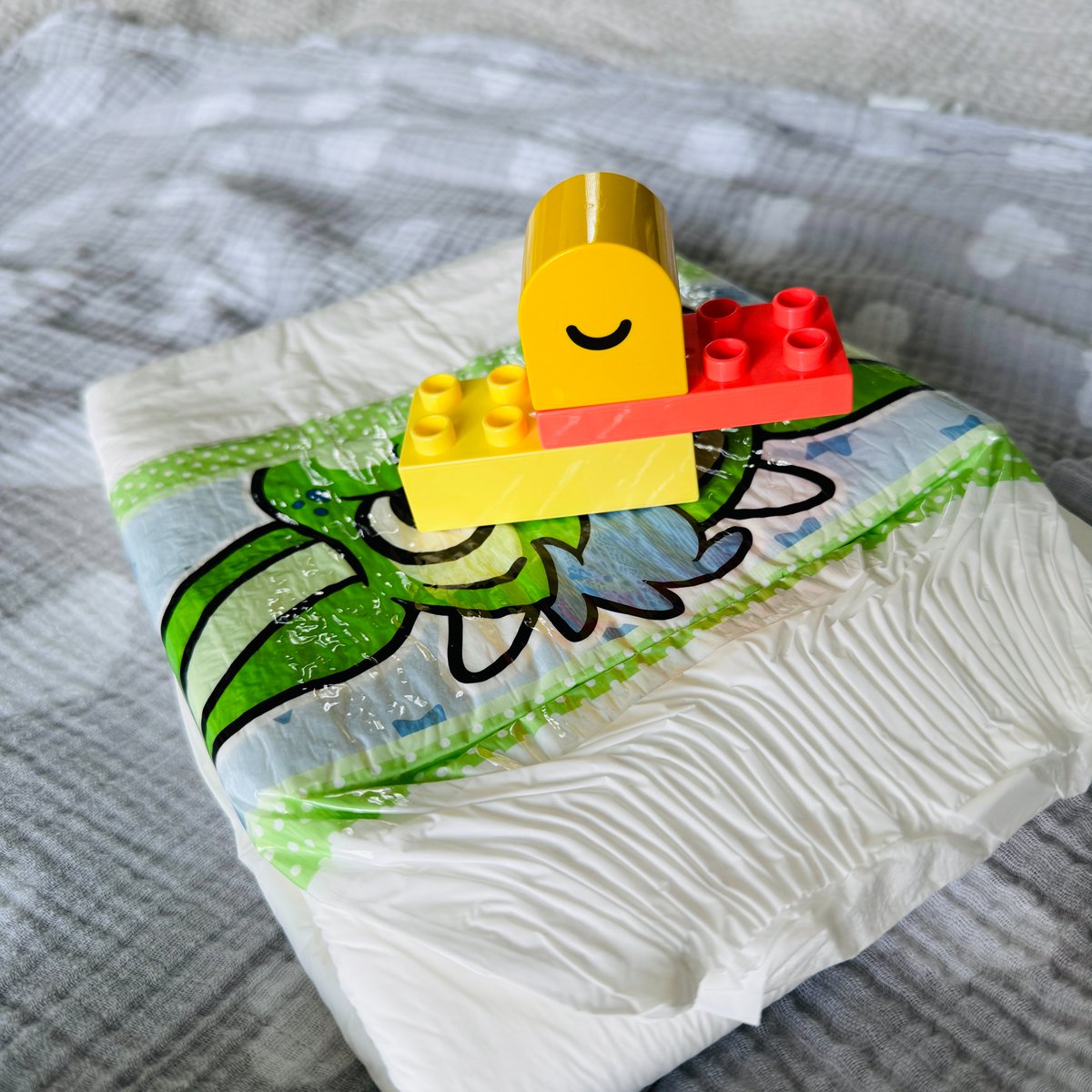 Oh, to be a toy duck sleeping on a giant diaper...  

But you can at least be comfortably snuggled in a diaper!  

ABUniverse.com 🦆   

#abdl #ageplay #ageplayer