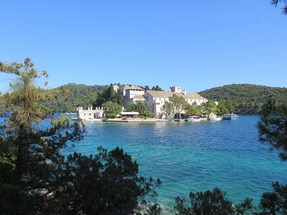 NZAllison's tweet photo. Croatia 2015. We're on the island of Mljet where we went for a 12km bike round two lakes. Beautiful day and lovely clear water. The lakes reminded us of NZ with their bush down to the water.
#Mljet https://t.co/CH4ze289s2