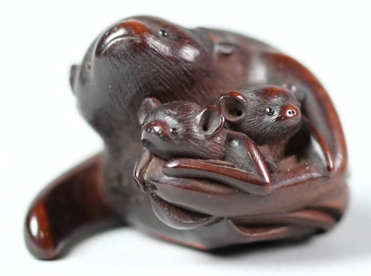 Netsuke depicting a mother bat with two young, carved from hō-raku wood, 19th century AD.

Bats in Japanese culture are symbols of happiness, luck, and prosperity due to the phonetic similarity between the words for "bat" (komori) and "fortune" (kōmori). Thus, bats often appeared