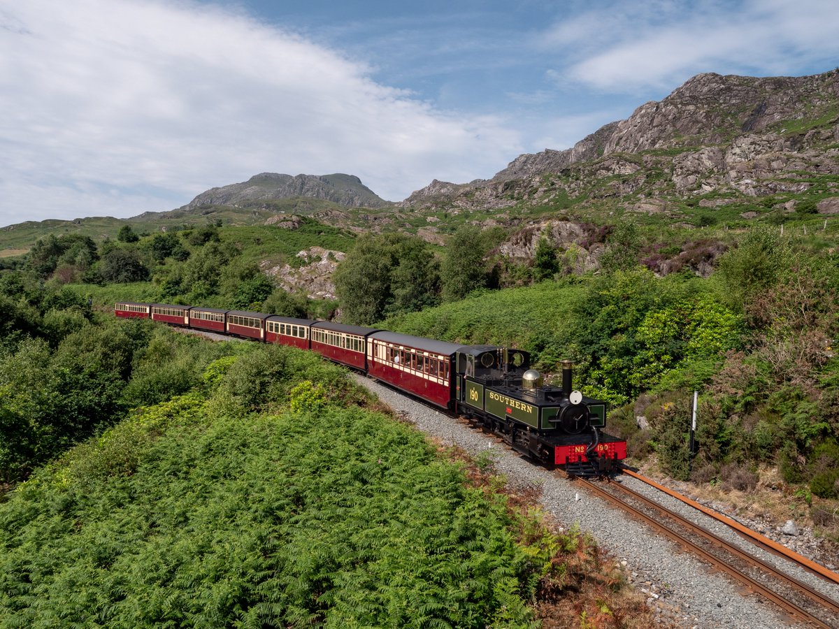 Tanygrisiau vista as  LYD  No 190 2-6-2T Side Tank, Works No 14/2010 is seen working the 0900 Porthmadog to Blaenau Ffestiniog.  Ffestiniog Railway 20/06/25