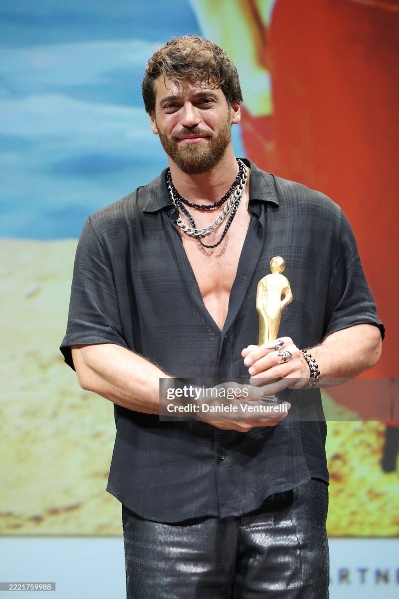 Can Yaman poses with the Excellence award international star during the Italian Global Series Festival 2025 at Teatro Galli on June 23, 2025 in Rimini, Italy.