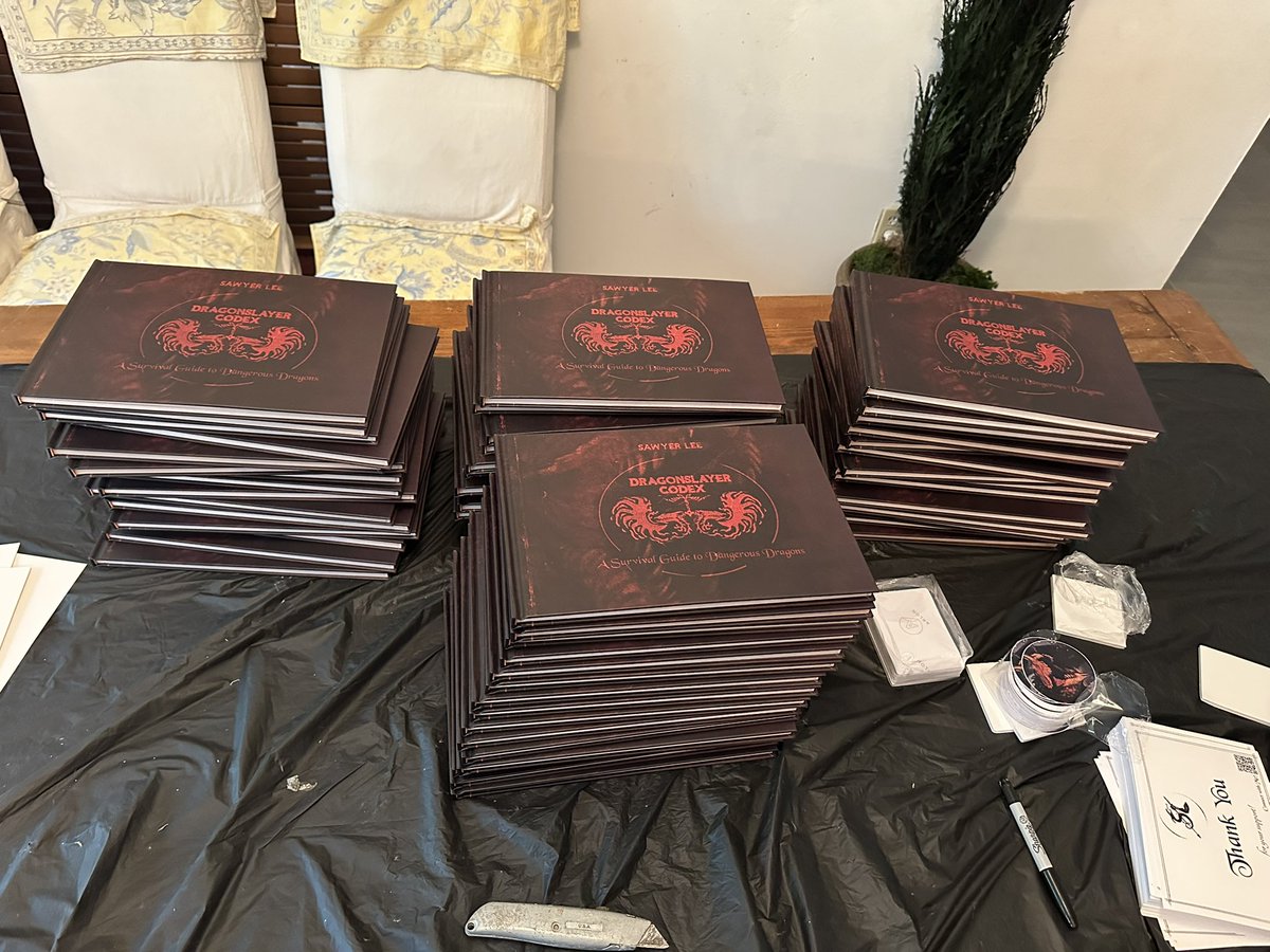 sawyerleeart's tweet image. Will be working to make books available to those who missed the Kickstarter once I’m through with the preorders! Got a few options.
(Fun pile from today’s fulfillment grind doing it the old fashioned way with just me and some packing tape).