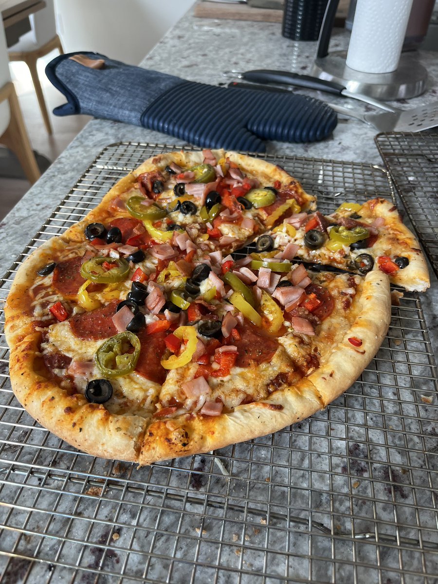 chrishsmith16's tweet image. Just made this up. Pizza baked on the @Traeger and a beer. Calling it pizza beer night. 🍻 you should try it.