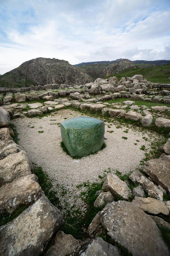 The Green Stone lying in one of the storerooms of the Temple complex in Hattusa, which was the capital of the Hittite Empire until it was destroyed around 1200 BC. The stone, which is thought to have been made from serpentinite, may have played a role in some religious cult [40…