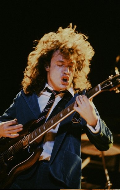 Angus Young live at Nippon Budokan in Tokyo, 1982. Photo by Koh Hasebe.