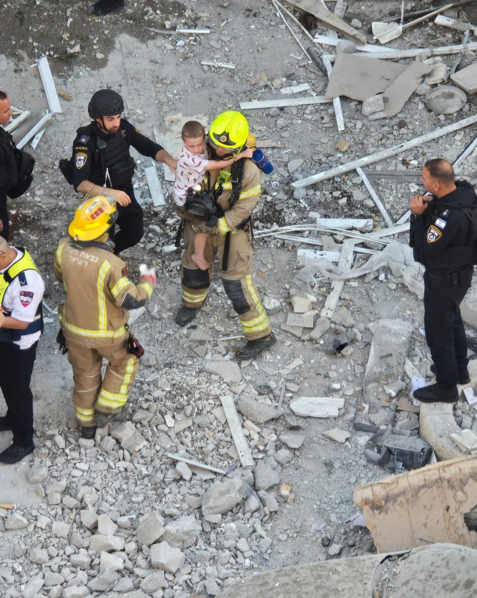 Another child has been pulled out from the rubble.