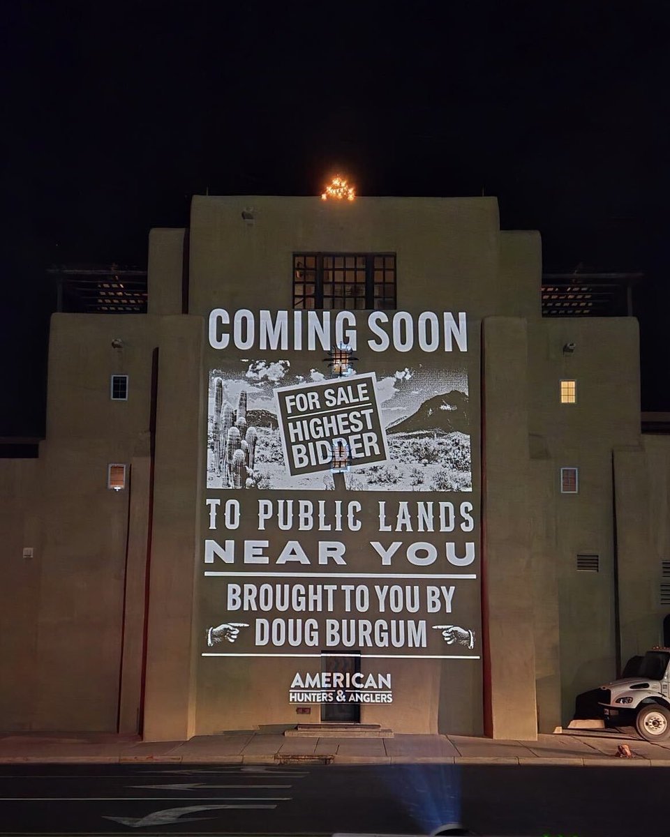 NoLandGrab's tweet photo. Since Doug Burgum’s in Santa Fe landsplaining Western governors, we thought we’d shine some light on his awful record.
30 feet tall. On his hotel.
Just a little reminder:
Public lands aren’t “America’s balance sheet”
They belong to the people — not the highest bidder. https://t.co/nNRWrK44En