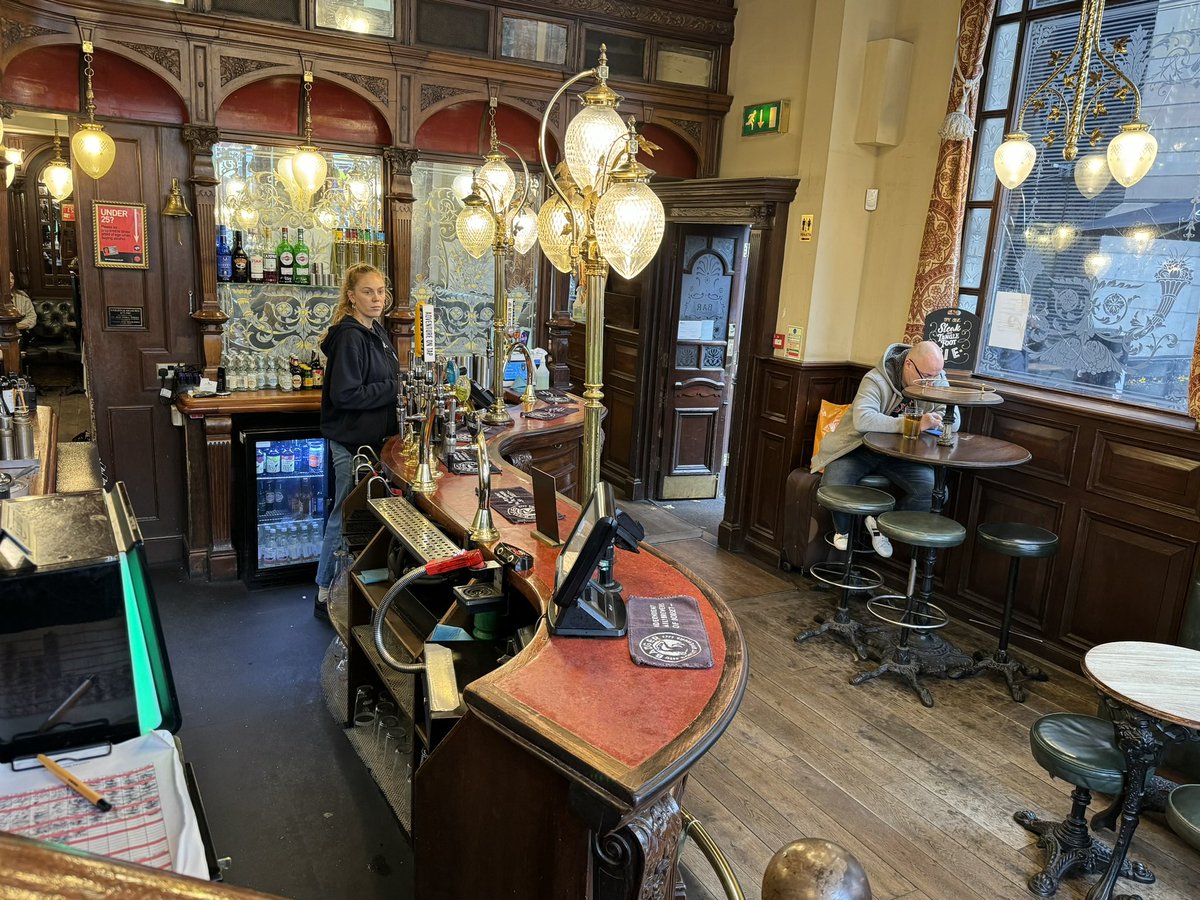 suekmoorhen's tweet photo. St Stephen’s Tavern is a stones throw from Big Ben, The Houses of Parliament and Westminster Abbey. Strike and Murphy meet there during the #TheRunningGrave investigation. A bit of a ‘pissing contest’ going on!! #TeamStrike
“A few days after first contacting him, Strike arrived at St Stephen’s Tavern in Westminster to hear what the CID officer had managed to find out.
The last time Strike had entered this particular pub had been with Robin, and as Murphy hadn’t yet arrived, he took his pint to the same corner table he and his detective partner had previously sat at, half-aware of a vaguely territorial instinct.
The green leather benches echoed those in the House of Commons a short distance away and Strike sat down beneath one of the etched mirrors, resisting the urge to read the menu, because his target weight remained unreached and pub food was one of the things he’d reluctantly decided to forgo……..”
……..”Yeah, well, I’ve got a vested interest in my girlfriend not getting shot,’ said Murphy.
Strike noted the nettled tone, smiled, checked his watch and announced that he’d better get going.
He might not have learned much about guns at Chapman Farm, but he felt it had been twenty minutes well spent, nonetheless.”
Ch 51 #TheRunningGrave