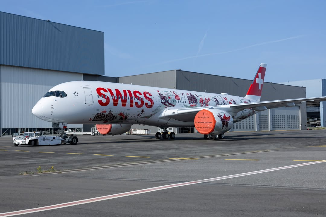 airwaysmagazine's tweet photo. 🔴 Airbus has rolled out SWISS’s first Airbus A350-900, featuring the Wanderlust special livery. It has just emerged from the hangar in Toulouse. #Airbus #avgeek https://t.co/Wk8bPV9OSe