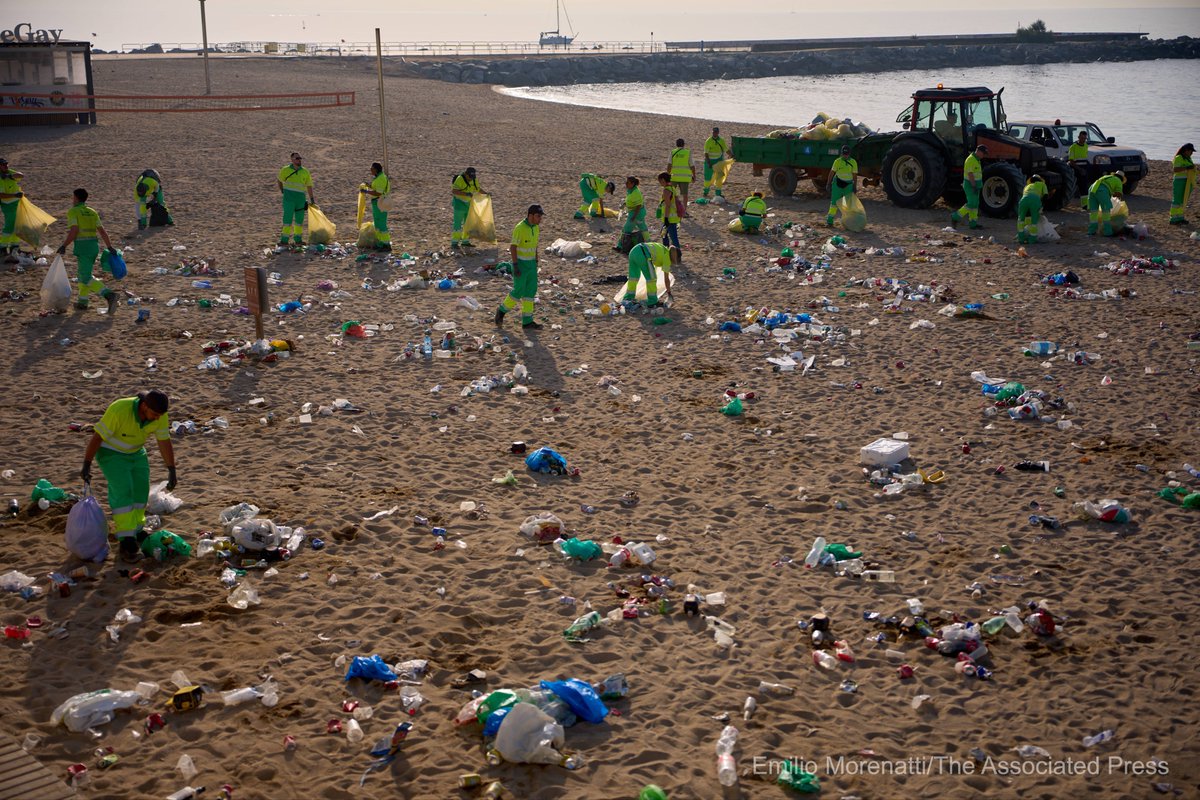 EmilioMorenatti's tweet image. Cleaning services collect trash left behind by revellers during the night of San Juan, that coincides with the summer solstice, marking the arrival of the summer season in Barcelona, Spain, Tuesday, June 24, 2025.