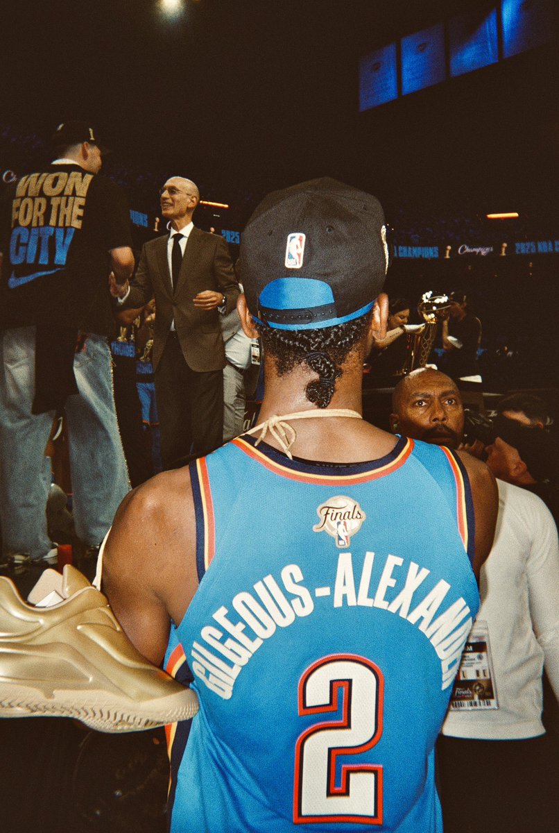 The Shot from The Finals on film.

Commissioner over one shoulder.
Larry O'Brien trophy over the other.
Gold signature shoes draped over both.

A pleasure to capture. 📸
