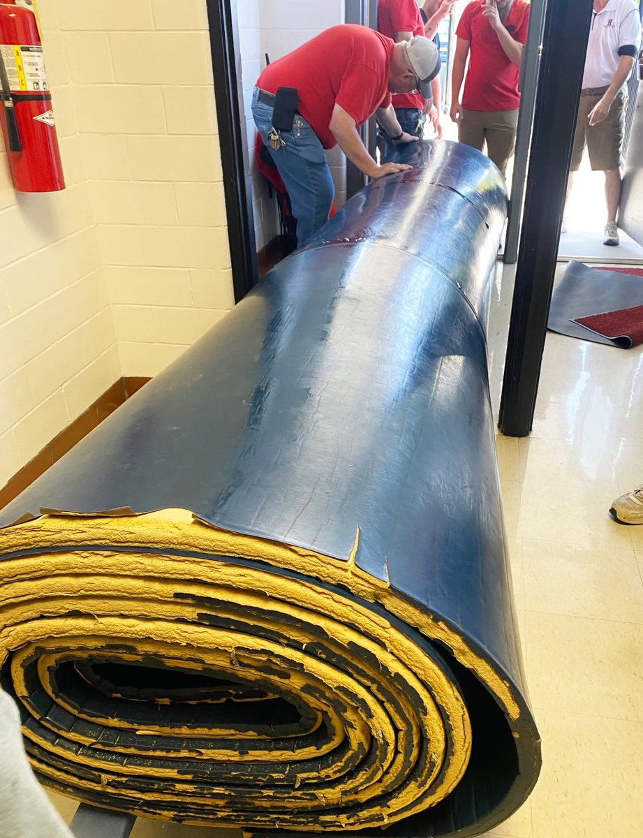 Taking care of what we have. Taylor's gym is getting a makeover. The old wrestling mats have been hauled away. They will be repurposed into new padding for the bottom of the gym walls. The basketball hoops are being removed, and the walls will be painted. #GoBlackcats.