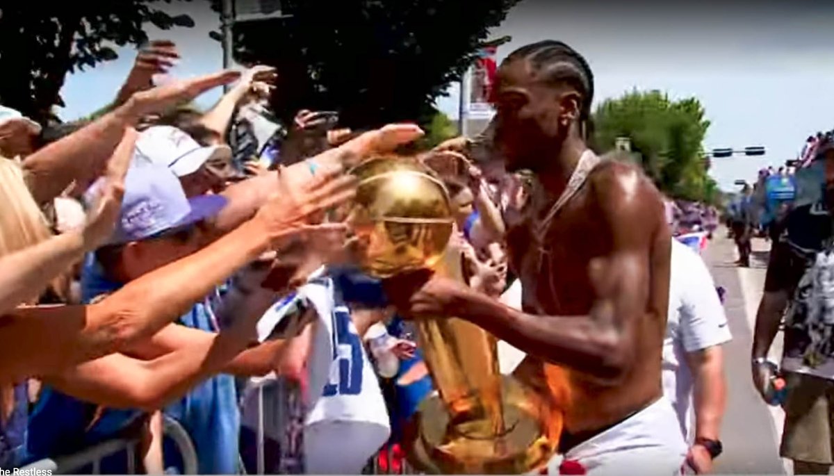 OKCTalk's tweet image. Just the season and finals MVP running down the street letting fans touch the Larry O'Brien NBA Championship Trophy! @okcthunder