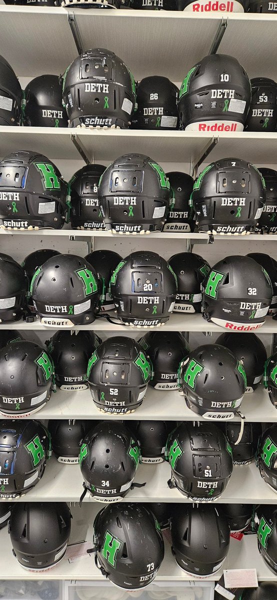 Handing out helmets this morning for upcoming padded camp in a week and a half.