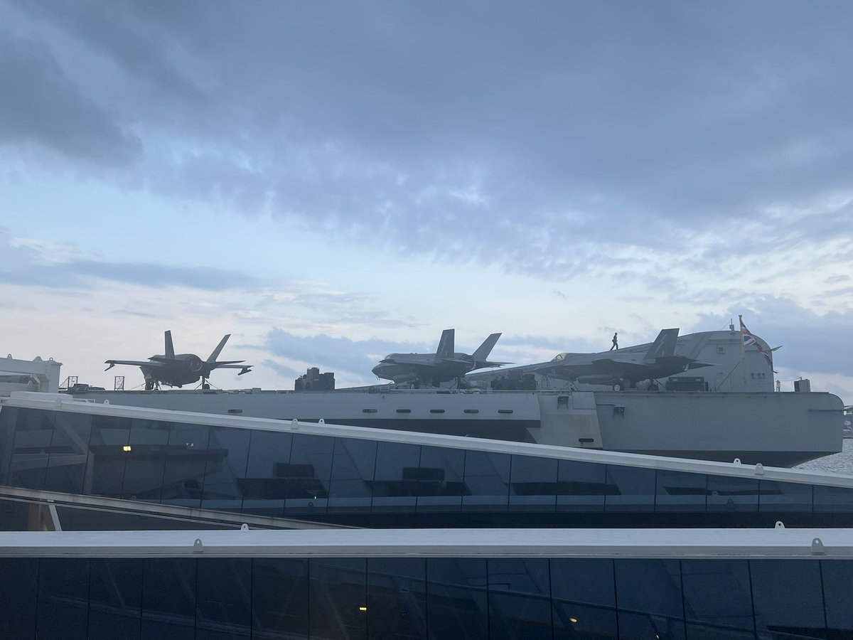 niravstoons's tweet photo. Since War is the topic - I noticed a British aircraft carrier parked in Singapore. It’s HMS Prince of Wales. 

Saw from office and went to take a closer look 

#AircraftCarrier #F35 #FighterPlanes 
#Singapore #HMSPrinceofWales https://t.co/ypuevJF4t3
