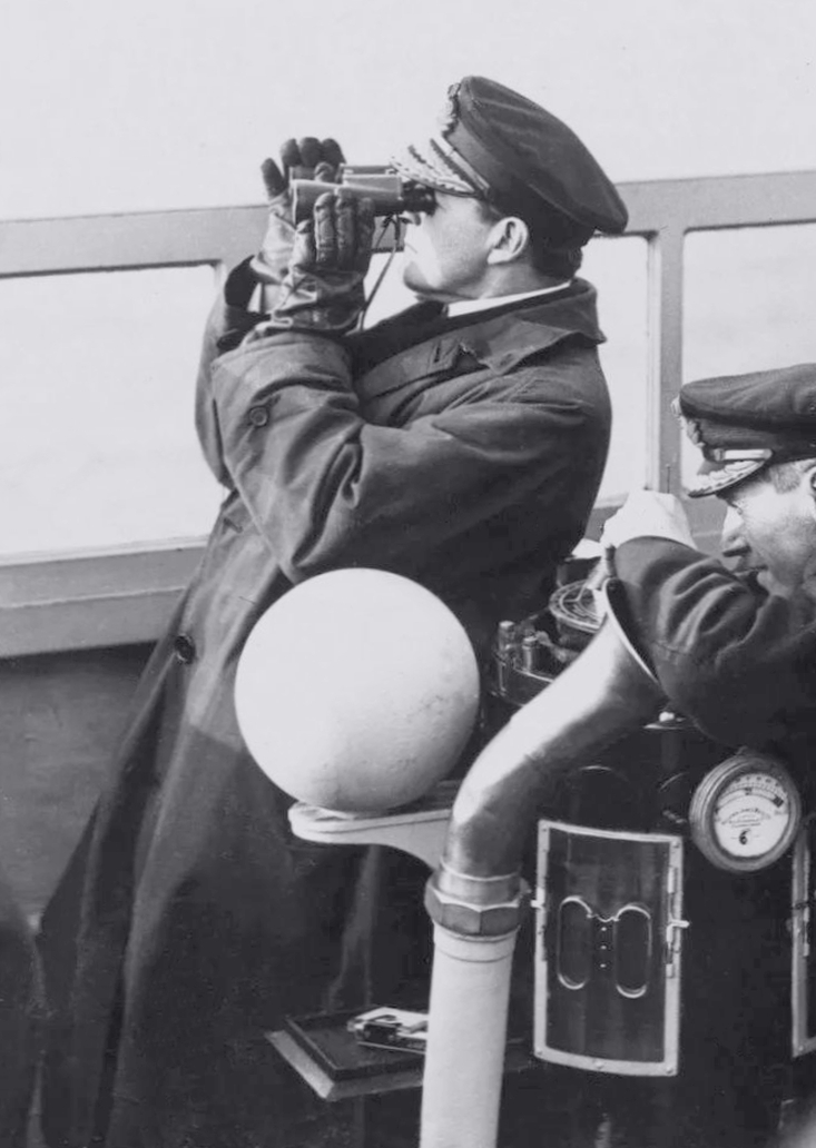 Date: November 21, 1918. Location: The Firth of Forth, UK. Event: Admiral David Beatty, Commander-in-Chief of the Royal Navy's Grand Fleet, is watching the arrival of warships of the German Navy's High Seas Fleet from the compass bridge of his flagship, battleship Queen